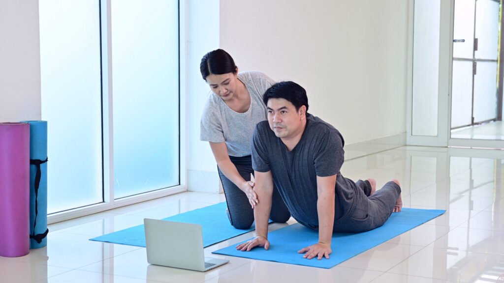 Couple doing an online training session at home
