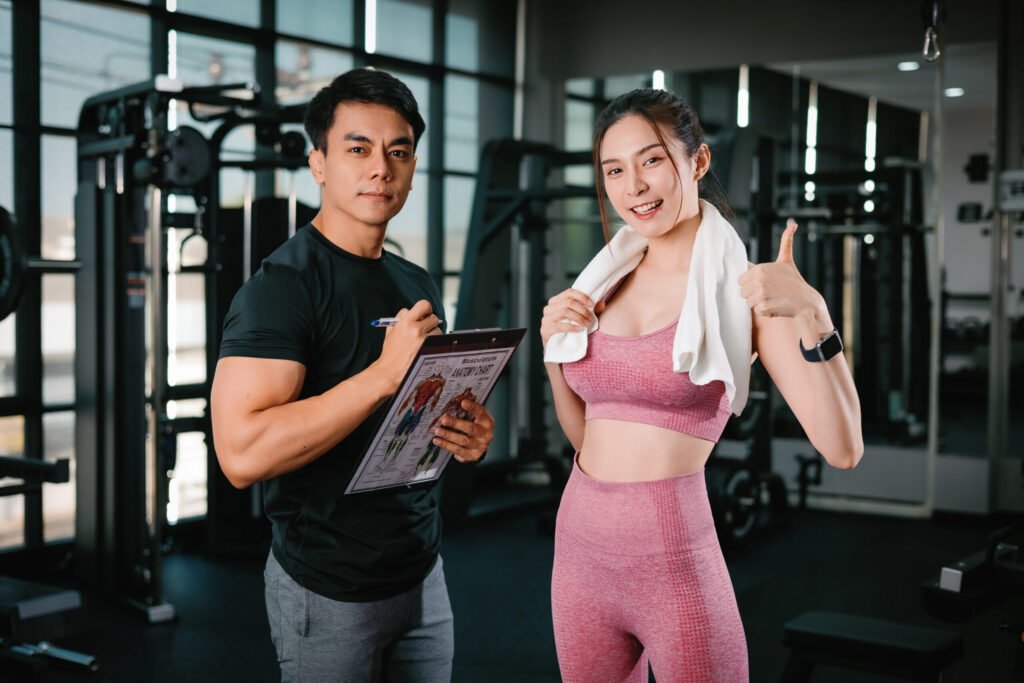 Client reviewing her training schedule with a coach